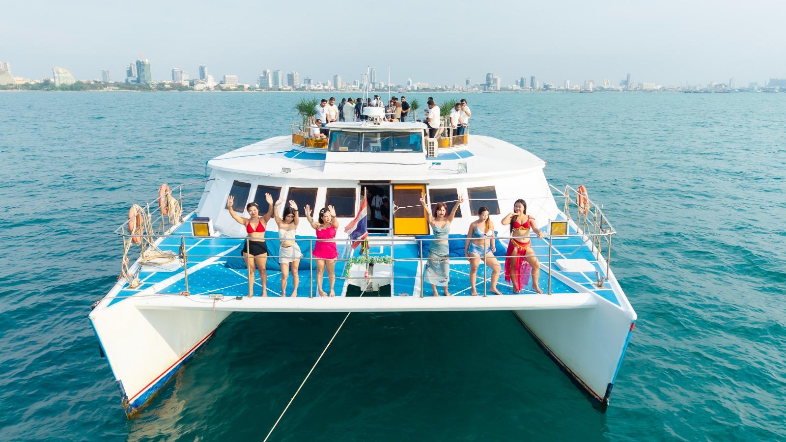 Live DJ playing music on deck during yacht party Pattaya